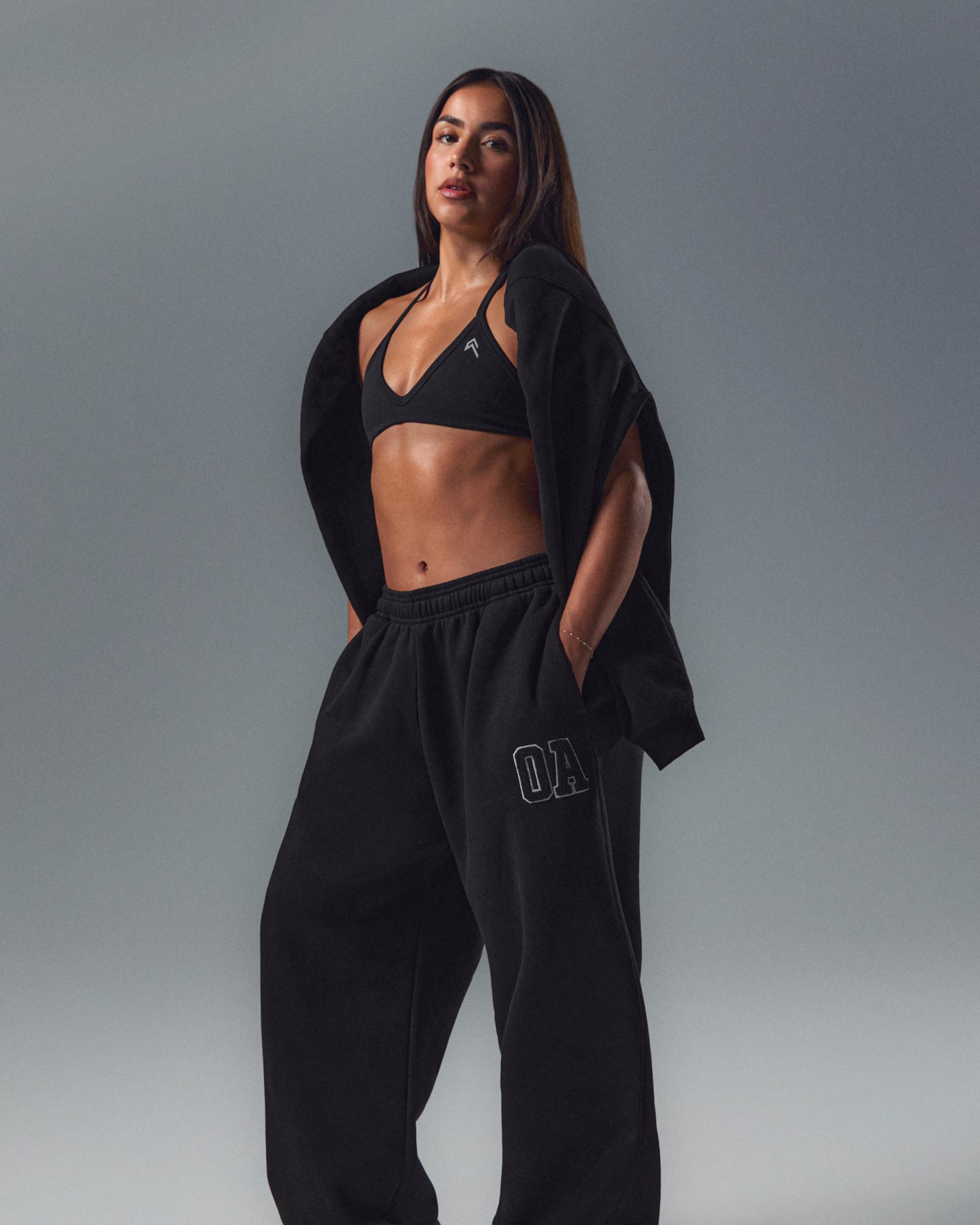 EnhanceLift Seamless Minimal Halter Neck Bralette with White Logo | Black - Image 2