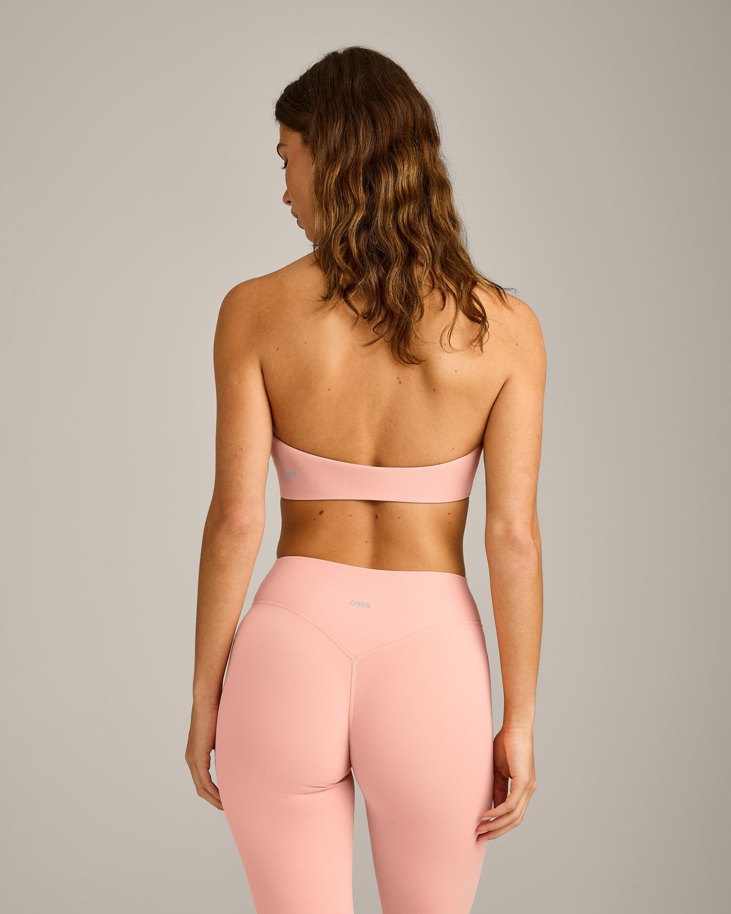 SoftMotion Minimal Halter Neck Bralette with Grey Logo | Peach Orange - Image 2