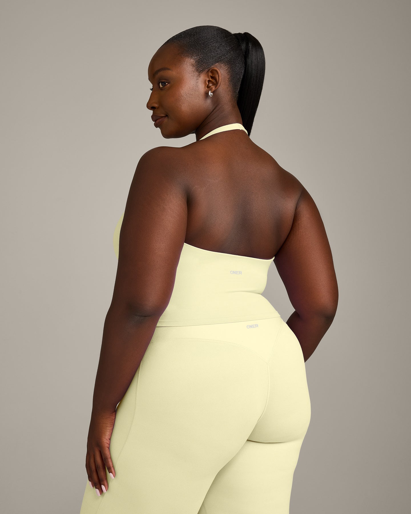 SoftMotion Halter Neck Mid Vest with Built in Bra Shelf with Grey Logo | Pastel Yellow - Image 2